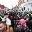 Moment police clash with protesters after arresting seven Kurdish terror suspects in London