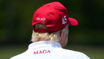 Donald Trump watches a golf tournament in May 2023 (AP Photo/Alex Brandon).