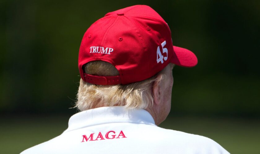 Donald Trump watches a golf tournament in May 2023 (AP Photo/Alex Brandon).