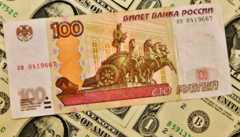 'Panic' in Russia as rouble slips to symbolic mark against US dollar