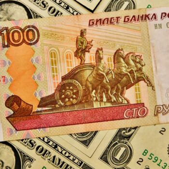 'Panic' in Russia as rouble slips to symbolic mark against US dollar