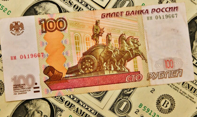 'Panic' in Russia as rouble slips to symbolic mark against US dollar