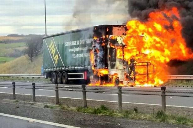 M62 and M60 rush hour chaos as HGV lorry catches fire - while carrying sawdust