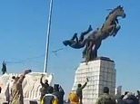 Dramatic moment Islamist rebels topple statue of Bashar Al Assad's brother as they storm Aleppo in Syrian president's biggest crisis yet - as Putin's forces hit back with airstrikes to help embattled regime