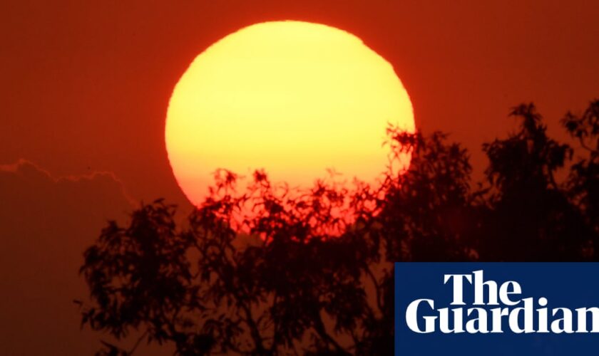 Australia’s heatwave to continue into next week as east coast braces for possible severe storms