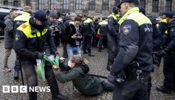 Dozens detained after protesters defy ban in Amsterdam