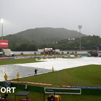 Covers on the pitch during a rain delay at the Daren Sammy cricket ground in St Lucia