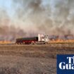 Heatwave sweeps across large parts of Australia as bushfire threatens Queensland border town