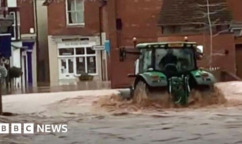 Man arrested over tractor drive through floods