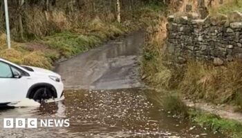 Man dies after car enters flooded ford