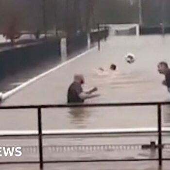 Storm Bert: Football team swims in flooded pitch