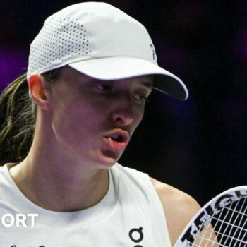 Iga Swiatek reacts during a match at the 2024 WTA Finals