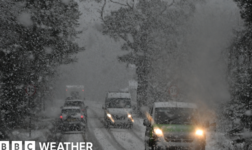 Vehicles navigate snowy conditions near Glenmore on the road to the Cairngorm ski area