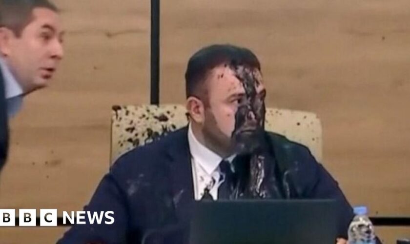 Watch: Georgia election chief doused with paint