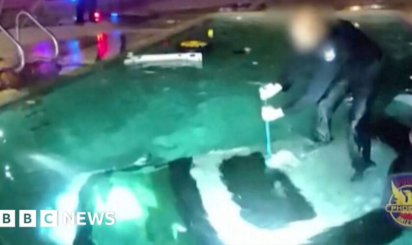 Watch: Moment police officer rescues man trapped in submerged car