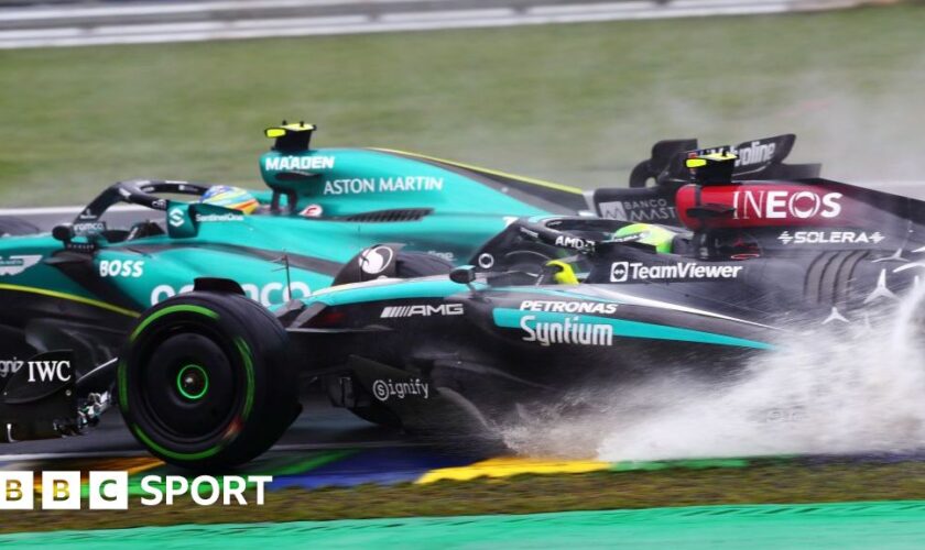 Spray comes up from Lewis Hamilton's Mercedes as he attempts to pass Aston Martin's Fernando Alonso during the 2024 Sao Paulo Grand Prix