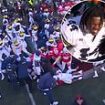 Massive fight breaks out between Michigan and Ohio State players as rivalry game ends in 'classless' violent scenes