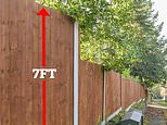 Man furious after he is given a CRIMINAL RECORD over his 7ft garden fence... but neighbours say 'it looks like a prison'