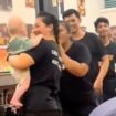 Restaurant staff watch baby so parents can eat meals in peace