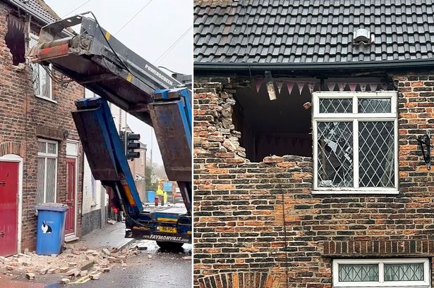 Woman in lucky escape as 46-tonne lorry ploughs through front of her home