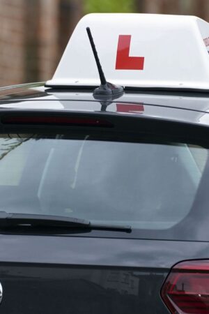 A learner driver drives down a street in Winchester, Hampshire. Picture date: Thursday May 20, 2021.