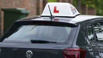 A learner driver drives down a street in Winchester, Hampshire. Picture date: Thursday May 20, 2021.