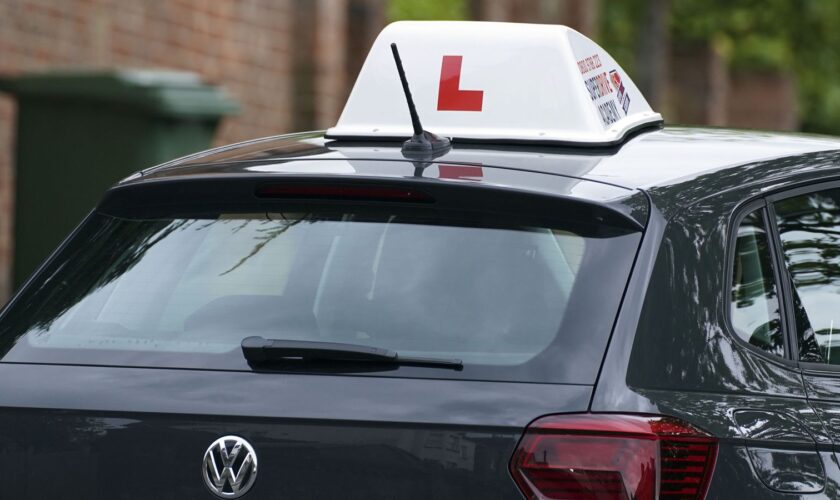 A learner driver drives down a street in Winchester, Hampshire. Picture date: Thursday May 20, 2021.