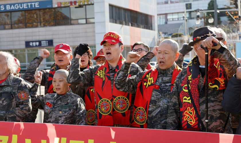 South Korean marine veterans demand the president's removal in Seoul. Pic: Reuters