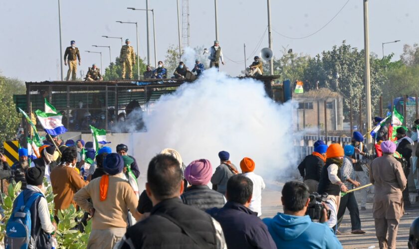 Police fire tear gas to disperse protesting farmers who were marching to New Delhi near the Punjab-Haryana border at Shambhu, India, Friday, Dec. 6, 2024. (AP Photo/Rajesh Sachar)