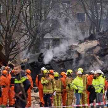 Rescuers search for victims after an explosion at a Dutch apartment block that killed at least 5