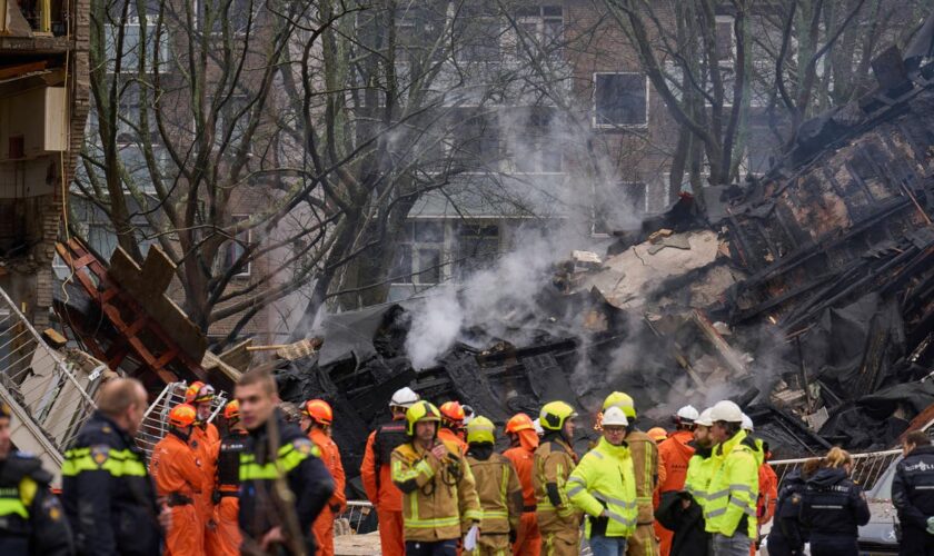 Rescuers search for victims after an explosion at a Dutch apartment block that killed at least 5