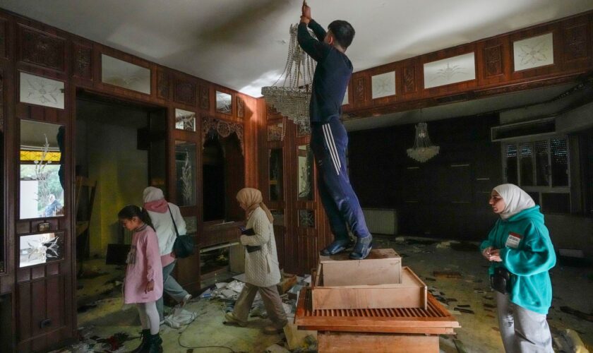 People inside a private residence of Mr Assad in Damascus. Pic: AP