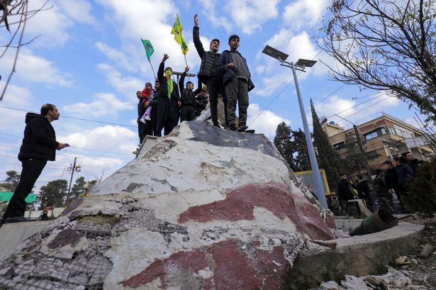 Joyful crowds celebrate across Syria as President Assad flees ending 50-year reign of terror