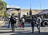 Tens of thousands of Syrian refugees who fled Assad's bloodthirsty regime RETURN: Huge queues form to get into the country as dictator is toppled and flees to Moscow