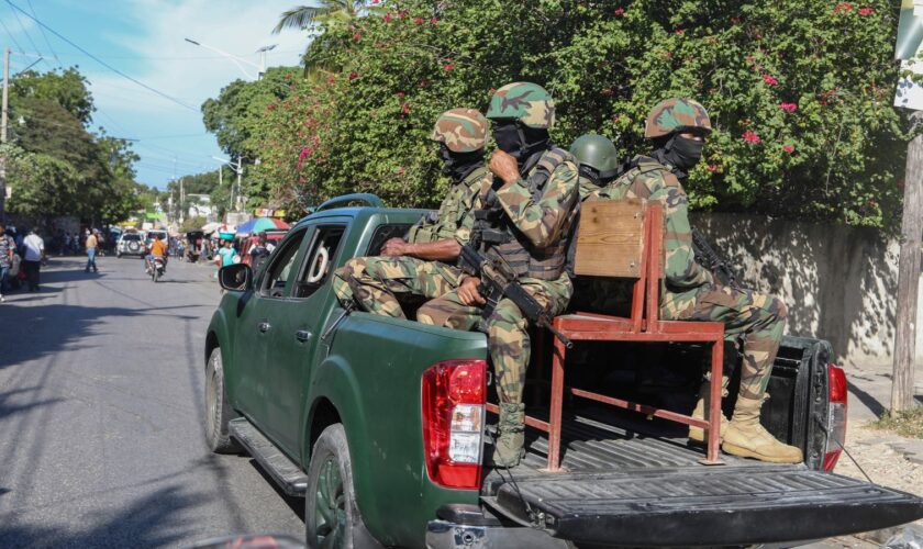 Soldiers patrol a street in Port-au-Prince, Haiti, Monday, Dec. 2, 2024. (AP Photo/Odelyn Joseph)