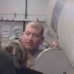 Plane passengers wrestle with 'hijacker' who stormed cockpit and wanted to divert plane