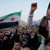 Syrian citizens wave the revolutionary flag and shout slogans as they celebrate during the second day of the take over of the city by the insurgents in Damascus, Syria, Monday, Dec. 9, 2024. (AP Photo/Hussein Malla)