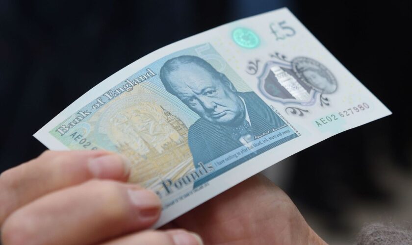 The new polymer ..5 note featuring Sir Winston Churchill, is unveiled at Blenheim Palace in Oxfordshire. PRESS ASSOCIATION Photo. Picture date: Thursday June 2, 2016. The new fiver will be issued in September, and in a break from the current paper notes it will be printed on polymer, a thin flexible plastic film, which is seen as more durable and more secure. See PA story MONEY Banknote. Photo credit should read: Joe Giddens/PA Wire