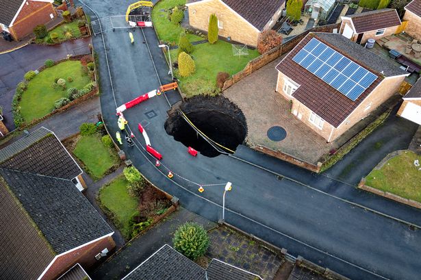 Sinkhole-hit Brits forced to leave homes hoping to return by Christmas