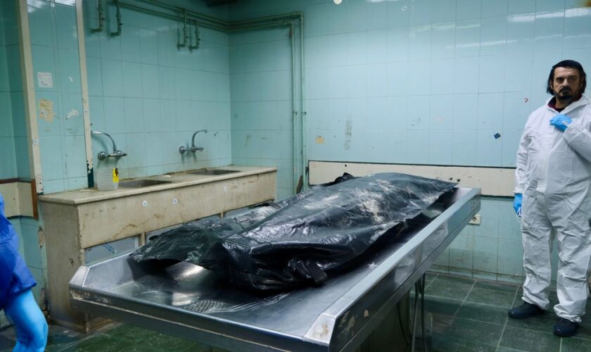 A body bag in an examination room of a hospital morgue in Damascus, Syria.