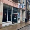 Depressing UK shopping street with empty stores and no Christmas lights