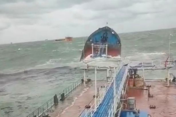 Two Russian tankers damaged in storm and crew member dead and leaking oil in Kerch Strait