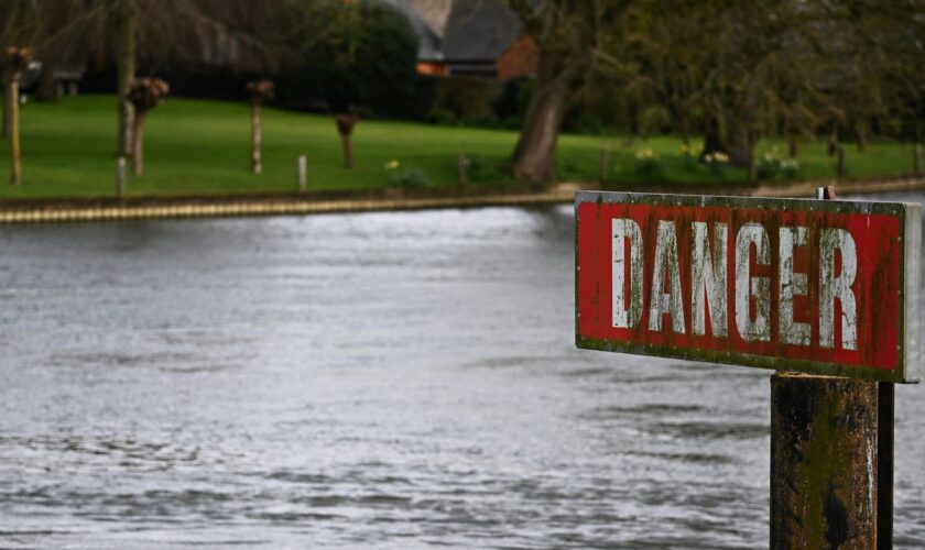 A "Danger" sign is seen on the River Thames, on the day data revealed sewage spills into England's rivers and seas by water companies more than doubled last year, in Hambledon, Britain, March 27, 2024. REUTERS/Dylan Martinez