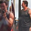 Take a day off, Hugh! Jackman shows off his bulging biceps during intense workout after travelling to Australia with his kids for Christmas following split from Deborra-Lee Furness