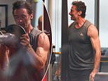 Take a day off, Hugh! Jackman shows off his bulging biceps during intense workout after travelling to Australia with his kids for Christmas following split from Deborra-Lee Furness