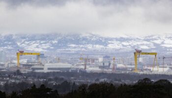 Low clouds over the snow covered Black Mountain behind the Harland & Wolff cranes on the east side of Belfast Lough. Much of the UK and Ireland is facing another day of cold temperatures and travel disruption after overnight lows dropped below freezing for the bulk of the country. A "cold plunge of Arctic air" has moved south across the whole country over the past few days, making it 5C-6C lower than usual for this time of year, the Met Office said. Picture date: Tuesday January 16, 2024.