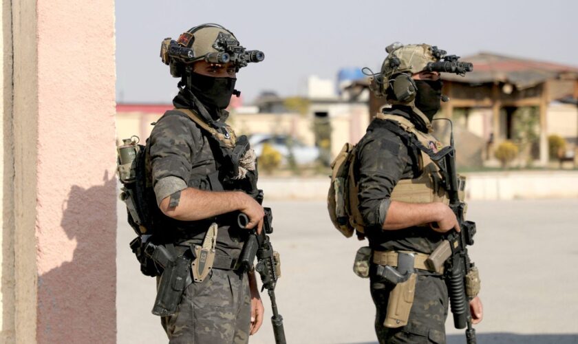 Members of the Kurdish-led Syrian Democratic Forces (SDF), backed by the US to fight ISIS, hold their weapons in Hasaka, Syria on 6 December. Pic: Reuters