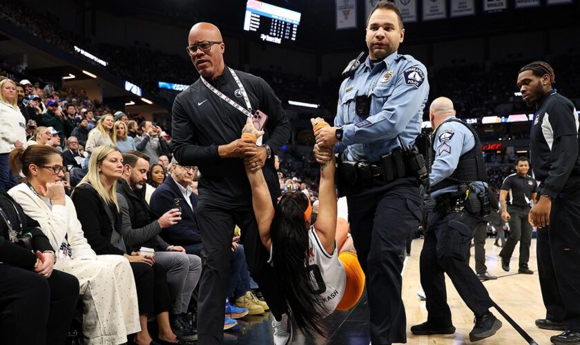 Security guards tackle two women to the ground during Knicks-Timberwolves game after they ran onto court