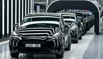 FILE PHOTO: Model Y cars are pictured during the opening ceremony of the new Tesla Gigafactory for electric cars in Gruenheide, Germany, March 22, 2022. Patrick Pleul/Pool via REUTERS/File Photo