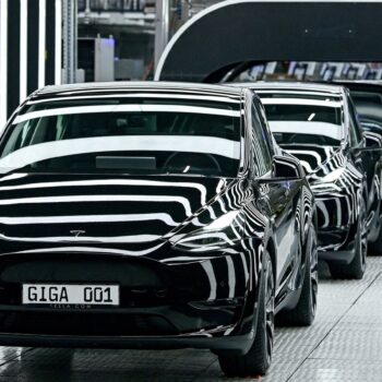 FILE PHOTO: Model Y cars are pictured during the opening ceremony of the new Tesla Gigafactory for electric cars in Gruenheide, Germany, March 22, 2022. Patrick Pleul/Pool via REUTERS/File Photo